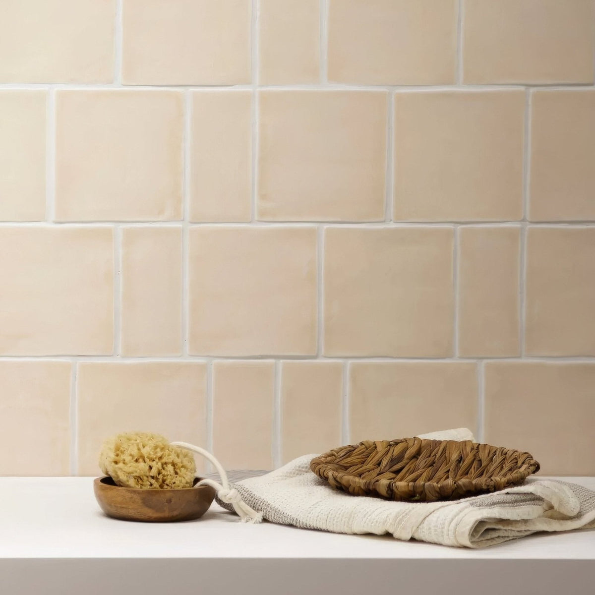 Beige ceramic subway tile with subtle texture and white grout from jaipur old ochre rectangle glazed tile collection