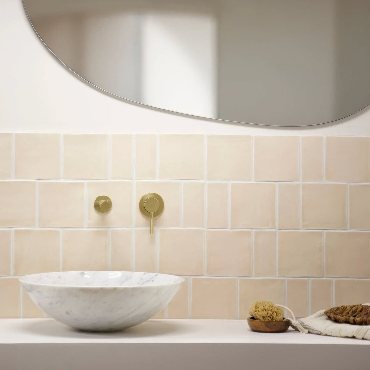 White marble bowl sink with subtle gray veining paired with jaipur old ochre rectangle glazed tile