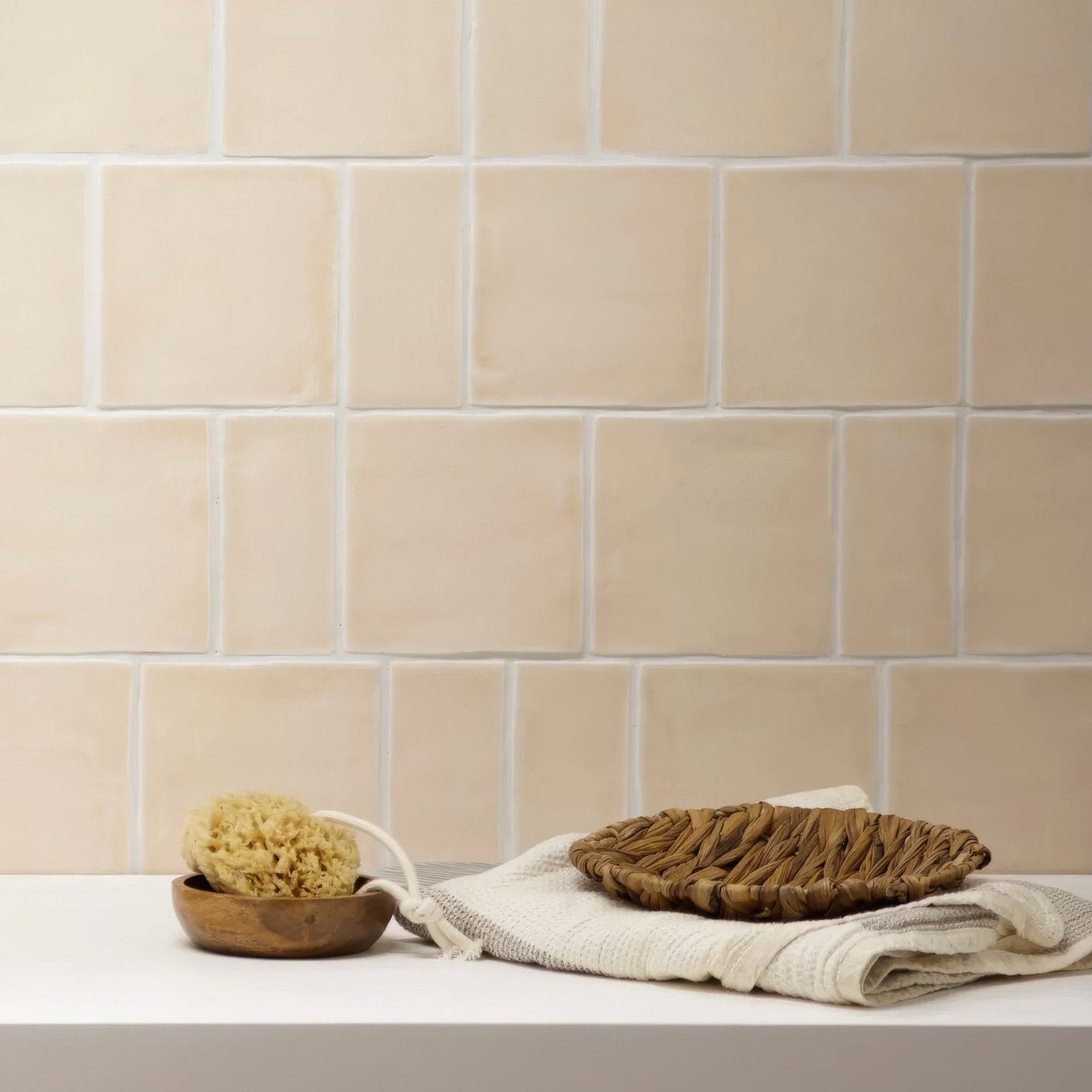 Beige ceramic jaipur old ochre square glazed subway tile with subtle texture and white grout for wall use
