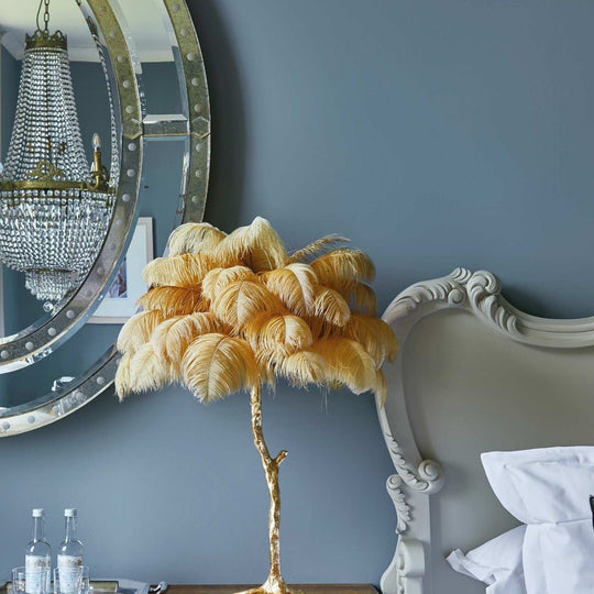 Jeane golden feathered table lamp with tree like base and soft fluffy yellow feathers for decorative lighting