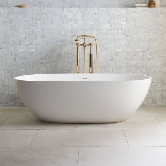 White freestanding bathtub with sleek oval design and polished brass faucet fixtures in Jerusalem Silver 60 x 30cm