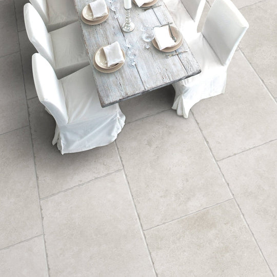 Weathered gray wooden dining table with white chair covers and place settings jerusalem silver 90 x 60cm