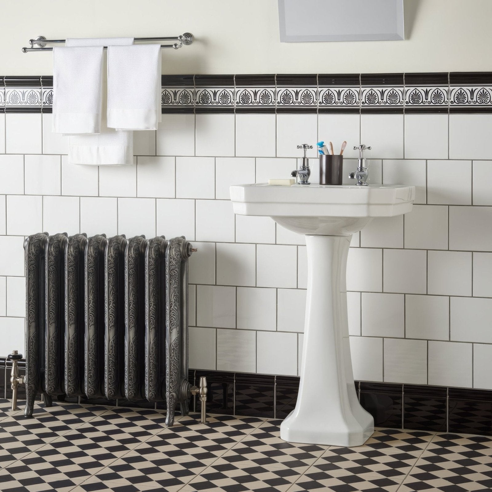 White ceramic pedestal sink with classic elegant design for jet black albert moulding collection