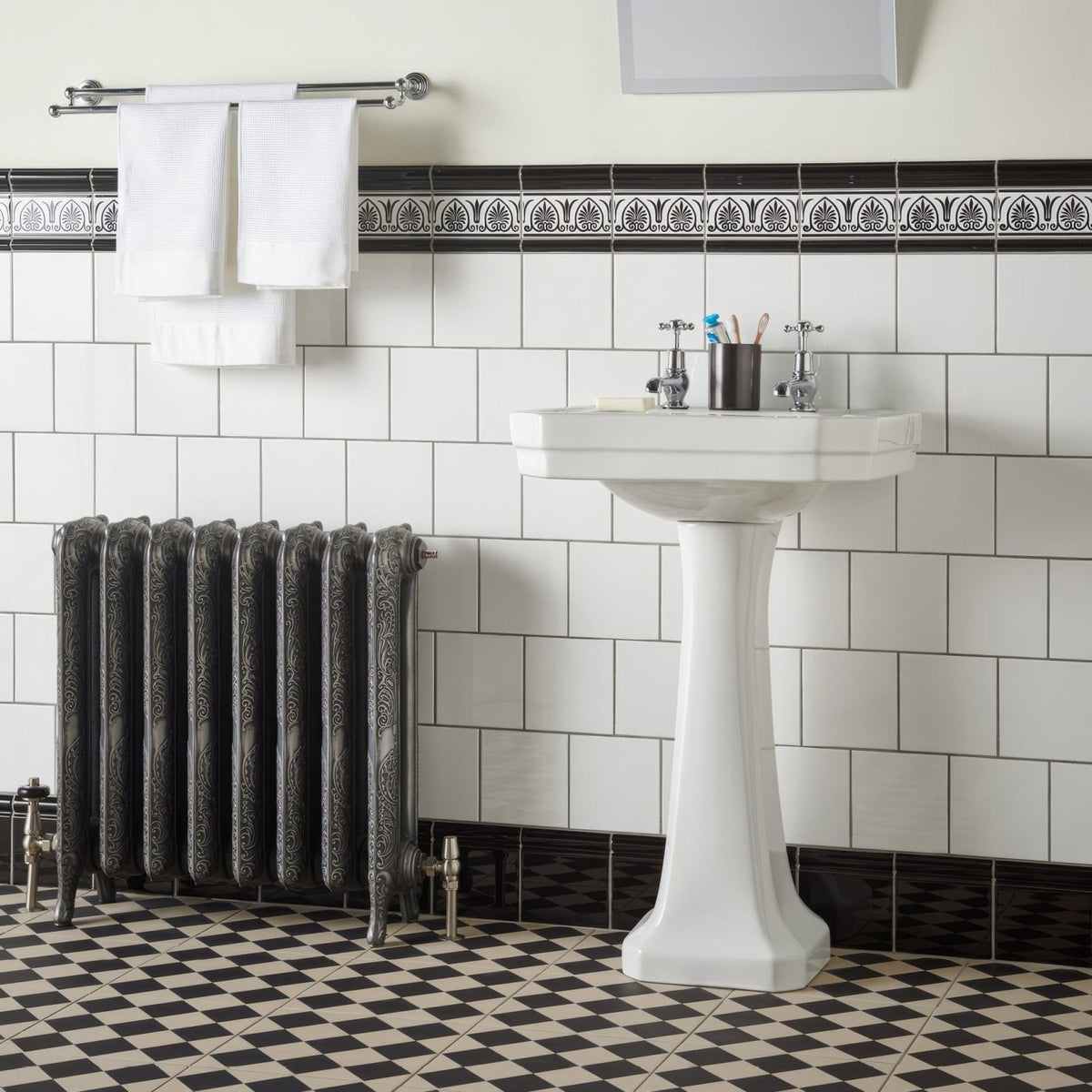 White ceramic pedestal sink with classic elegant design for jet black albert moulding collection