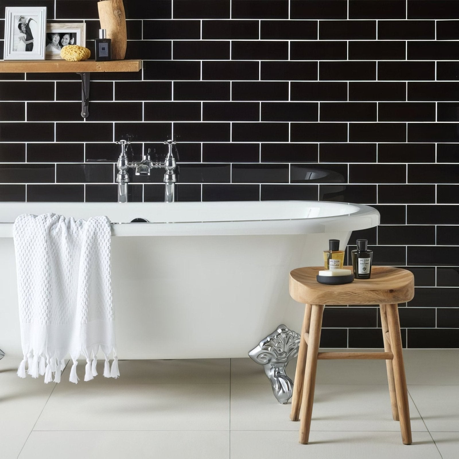 White freestanding bathtub with chrome fixtures and ornate silver claw feet featured in Jet Black Large Brick product