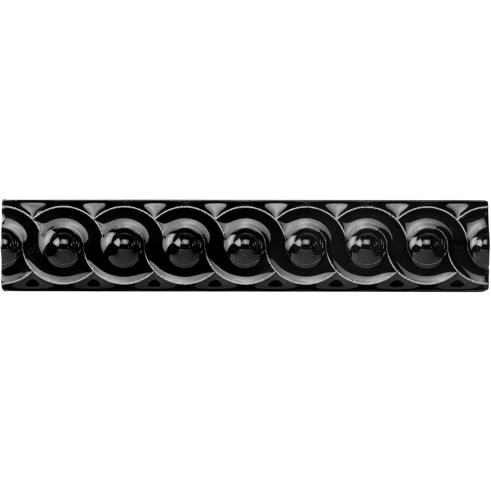 Black glossy ceramic tile jet black scroll moulding with raised interconnected circular motifs in a repeating pattern