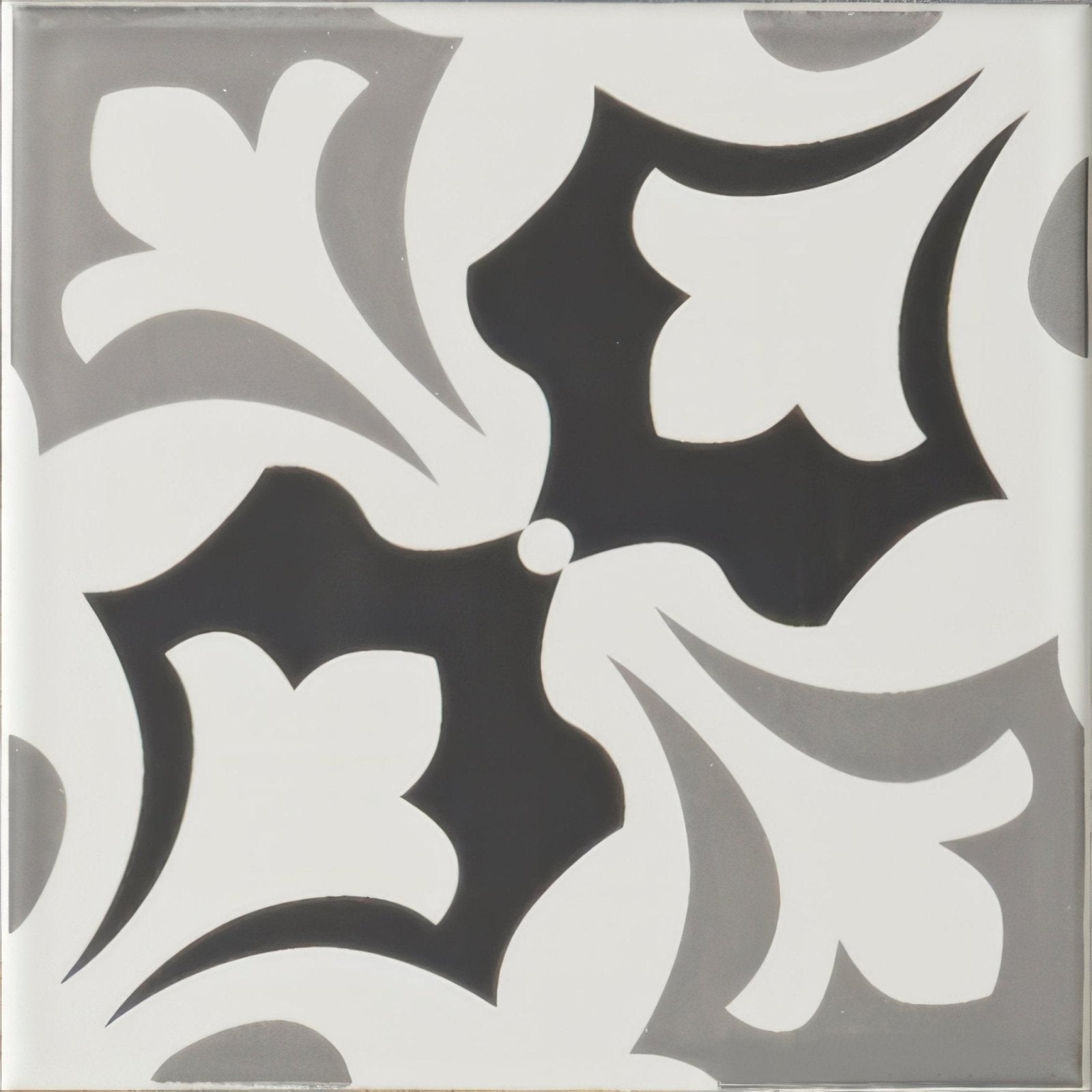 A square ceramic tile josette grey on brilliant white with a bold symmetrical black and white floral pattern and gray accents