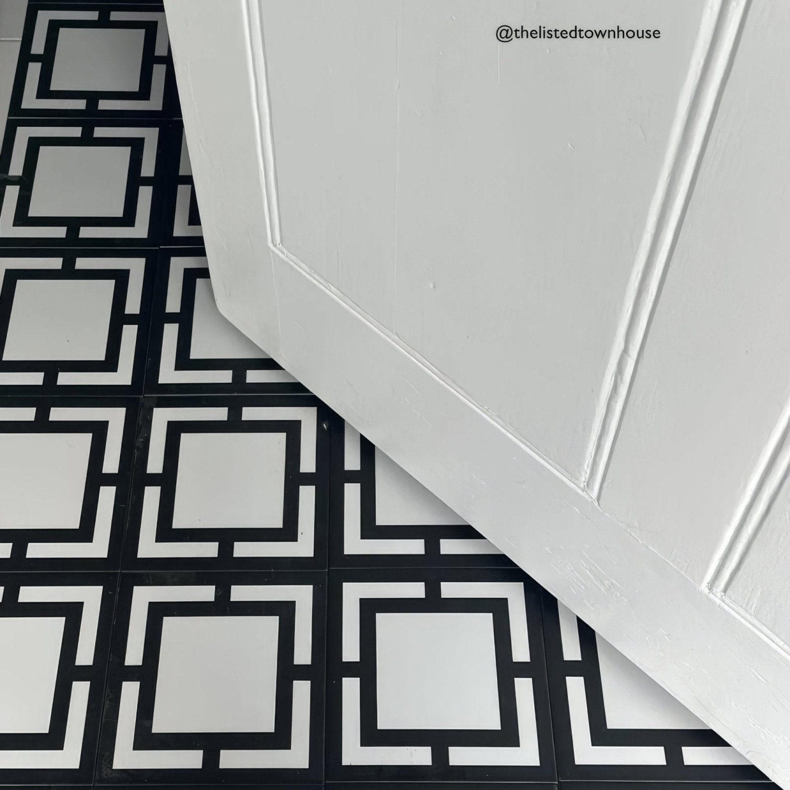 Black and white geometric patterned floor tiles with a clean modern design from kelly hoppen signature collection