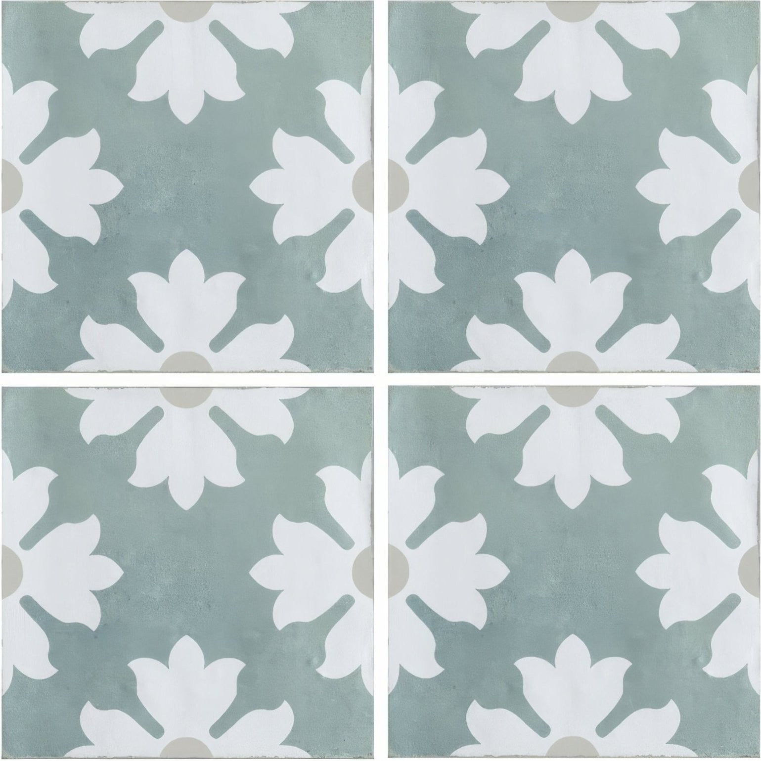 Kelmscott coleton blue patterned square tiles with a white floral motif on a muted sage green background