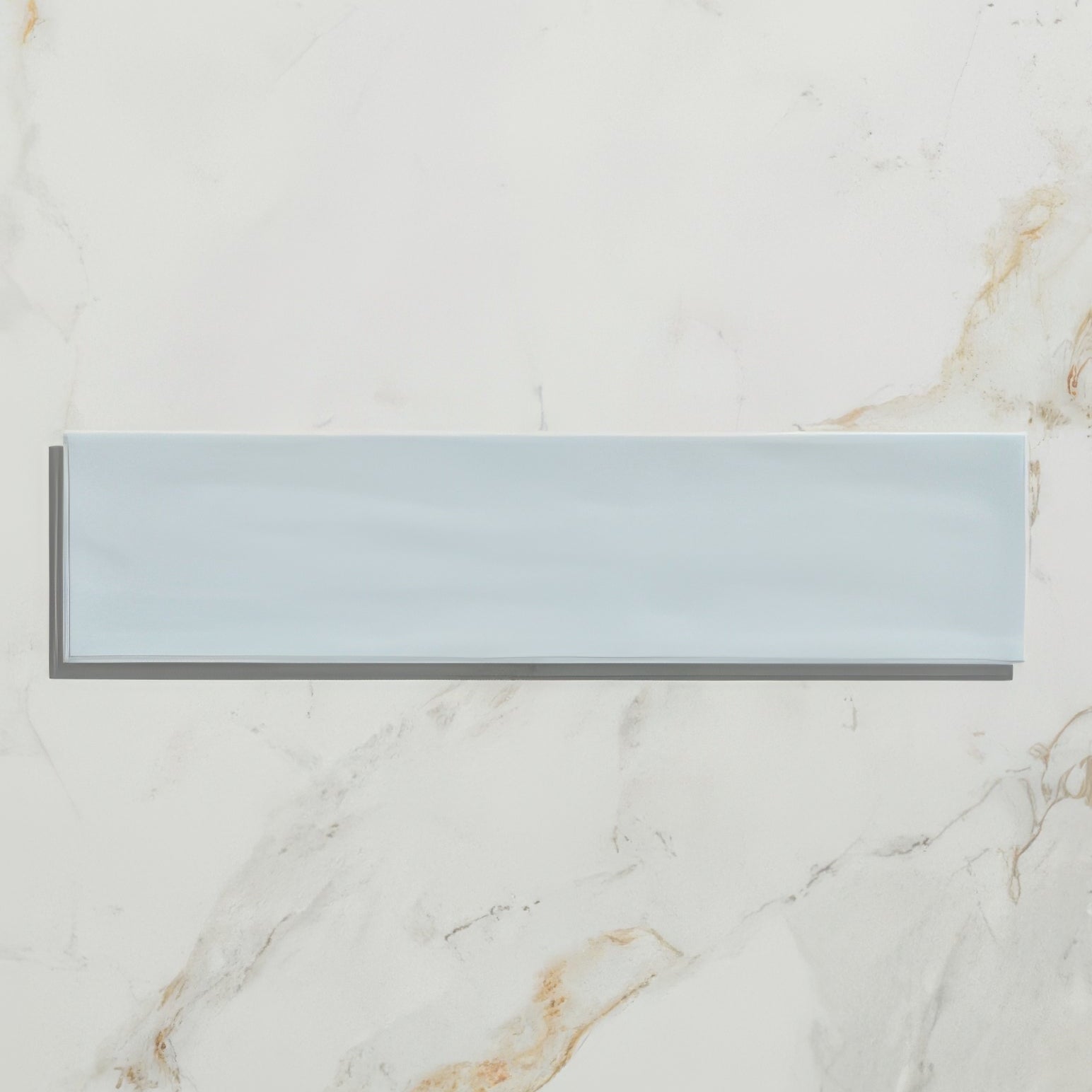 A sleek rectangular light blue Kennet porcelain sky ceramic tile with a smooth glossy finish