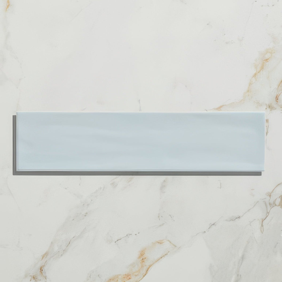 A sleek rectangular light blue Kennet porcelain sky ceramic tile with a smooth glossy finish