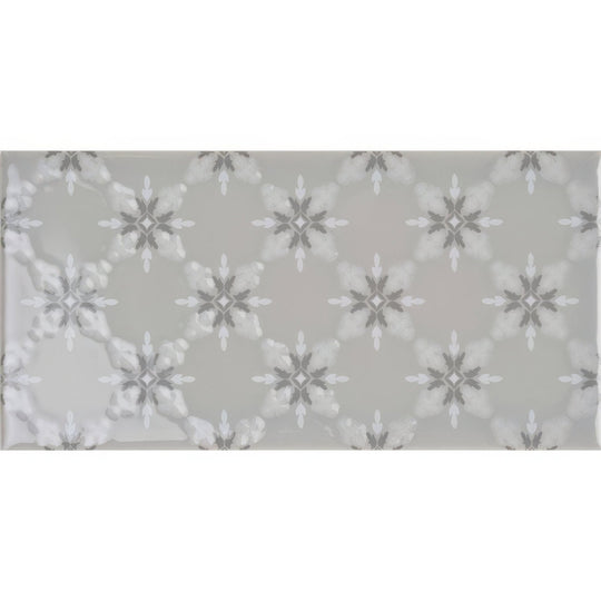Gray rectangular tile kew on dunwich with a repeating pattern of white and dark gray snowflake motifs