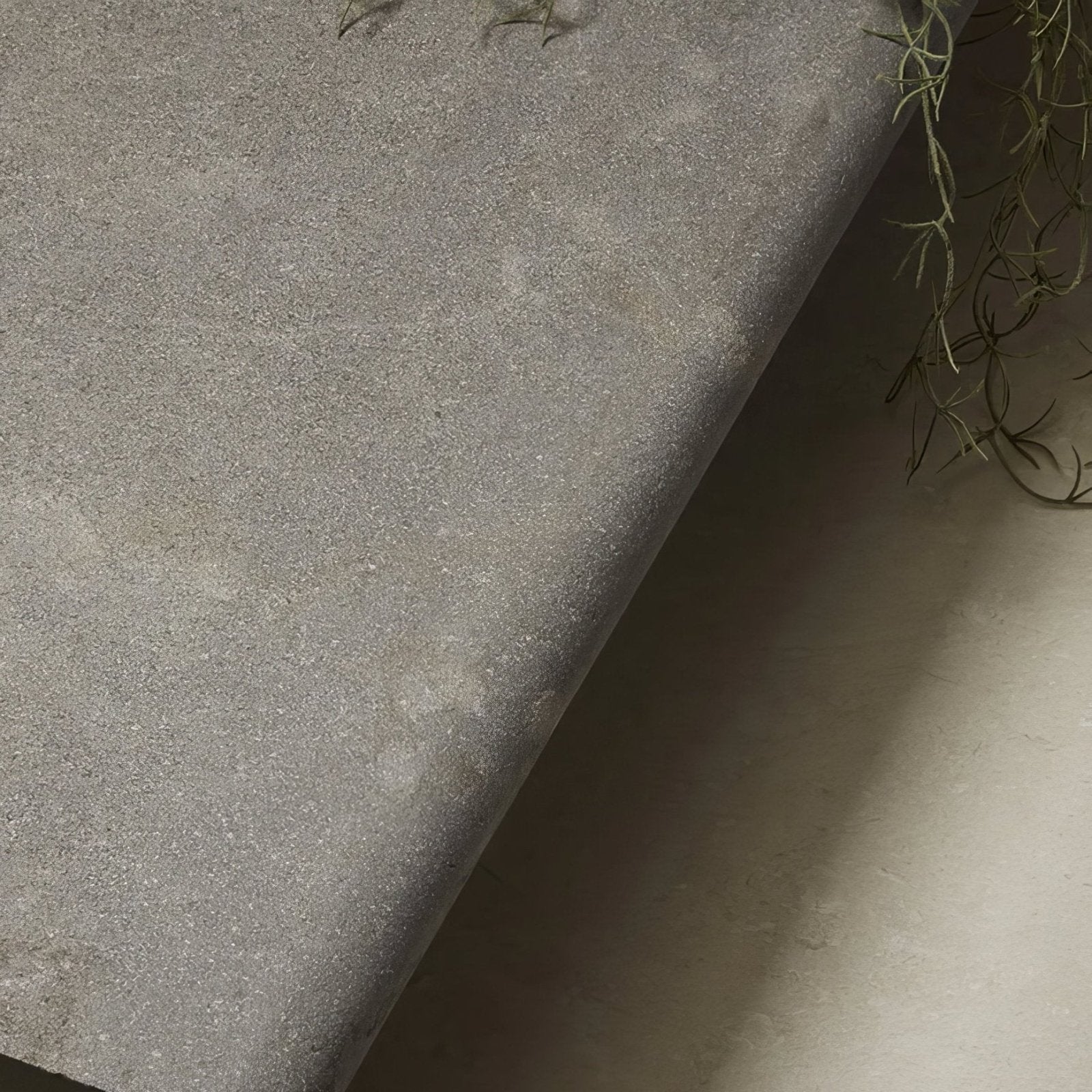 Kimmeridge limestone etched bullnose coping in gray textured fabric with a subtle speckled finish