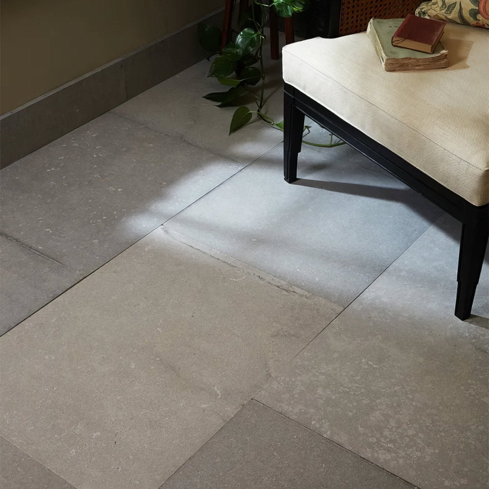 Beige kimmeridge limestone etched finish stone tiles with natural texture and tone variations arranged as floor surface