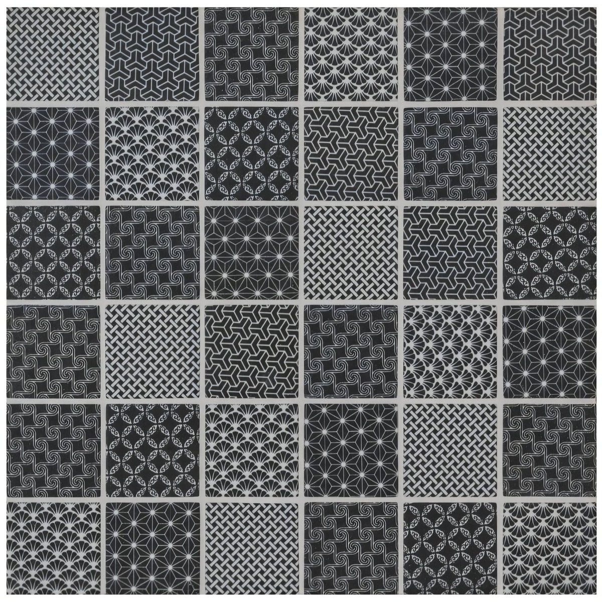 A collection of twenty-five black and white geometric pattern tiles made from kinetic black recycled glass