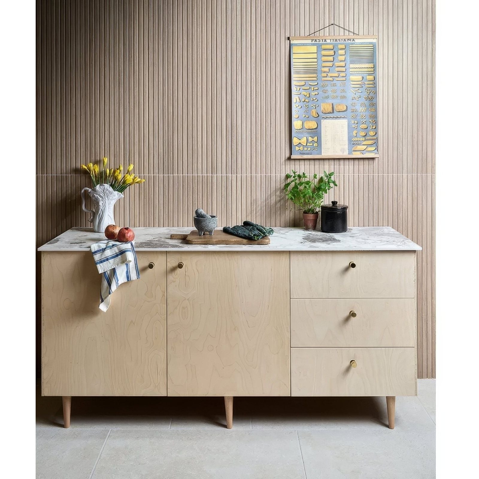 Kinfolk Porcelain Maple light wood-effect porcelain tiles with a sideboard and marble top