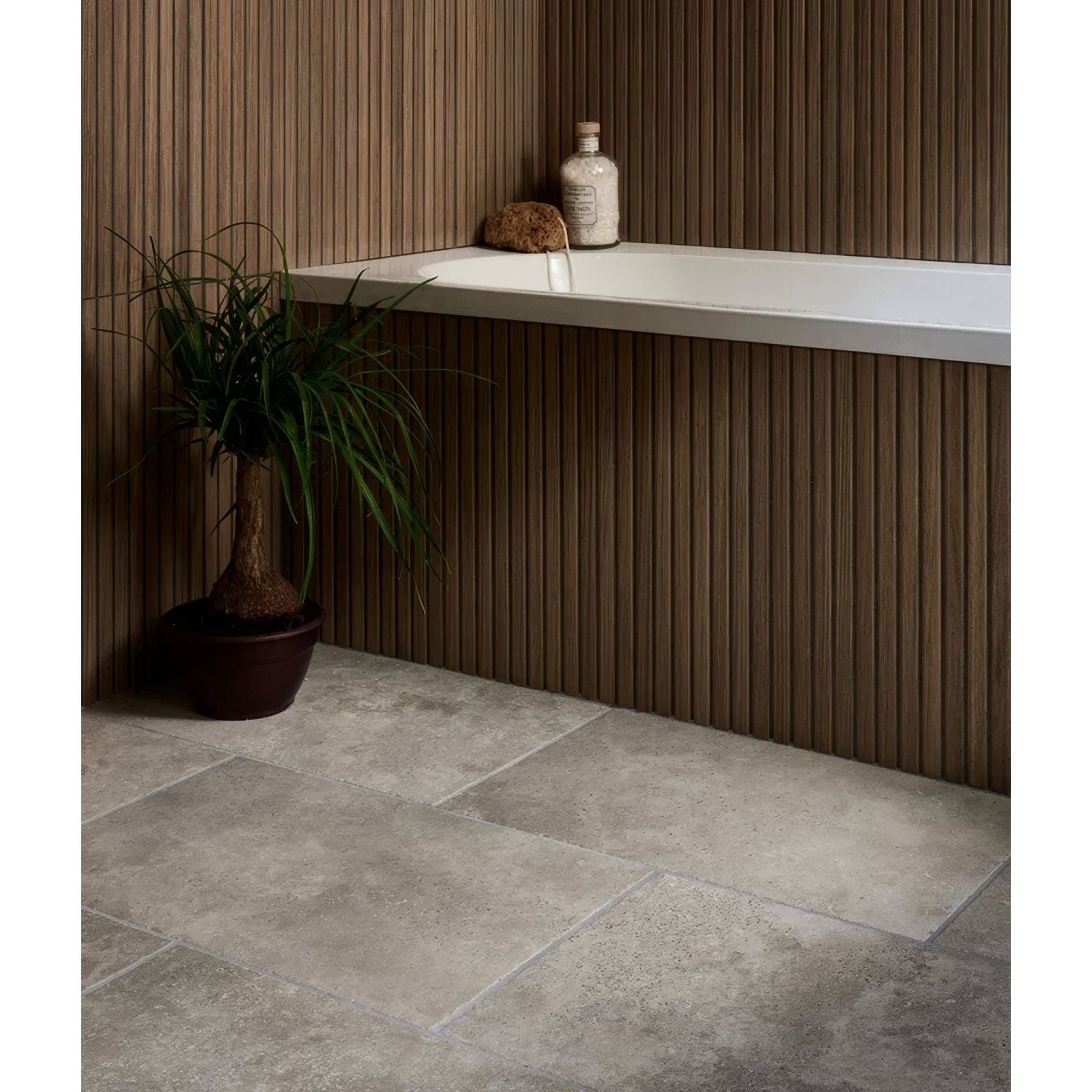 Kinfolk porcelain teak bathroom floor tiles in gray stone effect with subtle texture and natural veining
