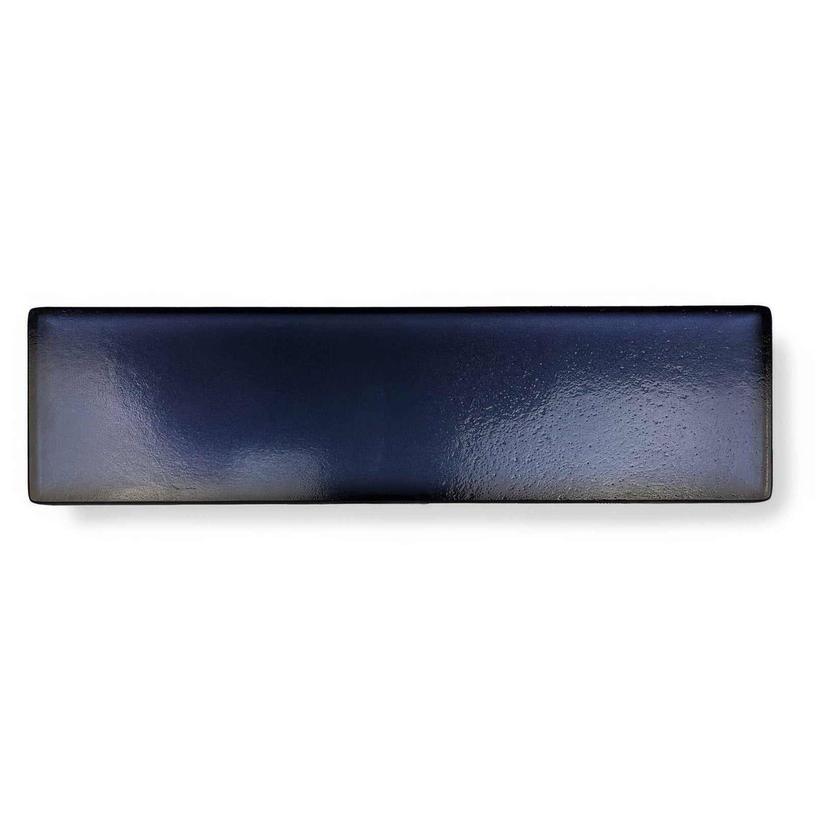 A sleek rectangular ceramic serving platter with a glossy deep navy finish and subtle textured surface