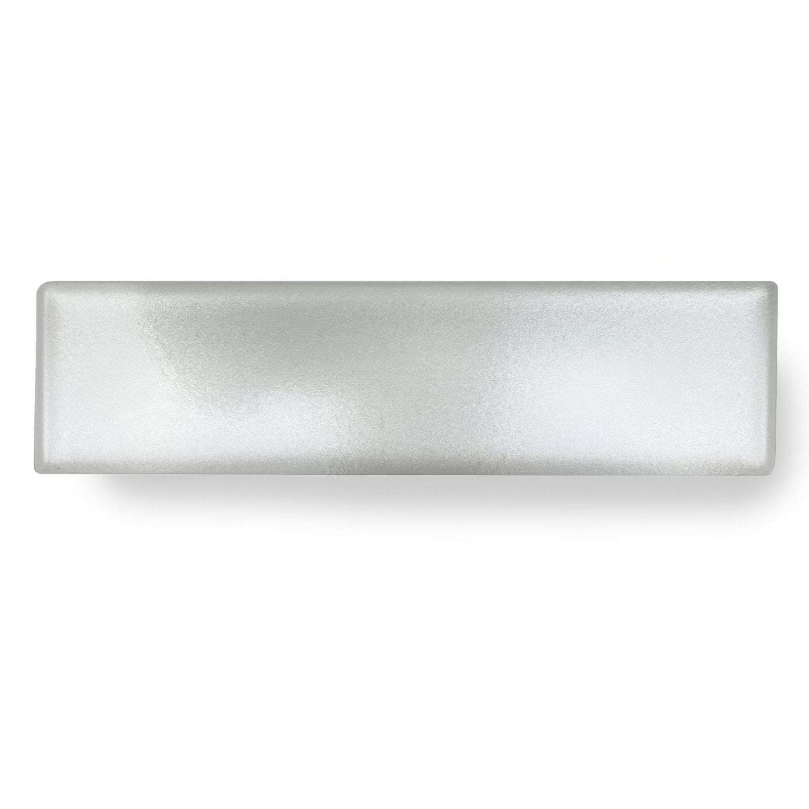 A sleek rectangular frosted glass drawer pull with matte finish and rounded edges for kingfisher white glass wall tile