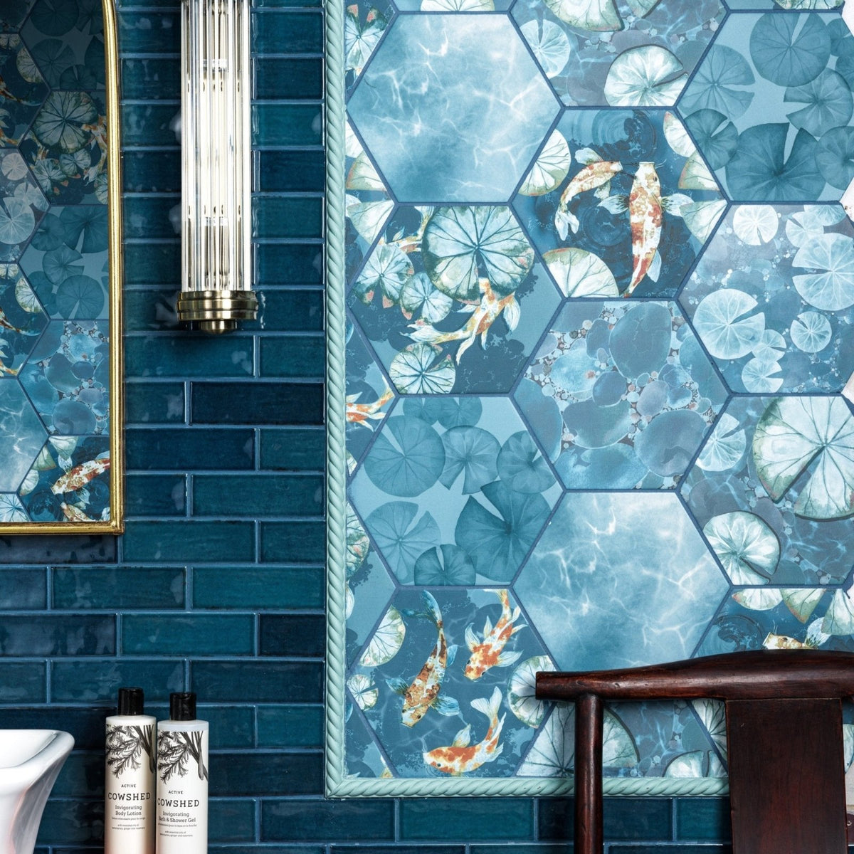 Kiyosumi porcelain hexagonal blue tiles with watercolor koi fish and lotus leaves framed by rope border