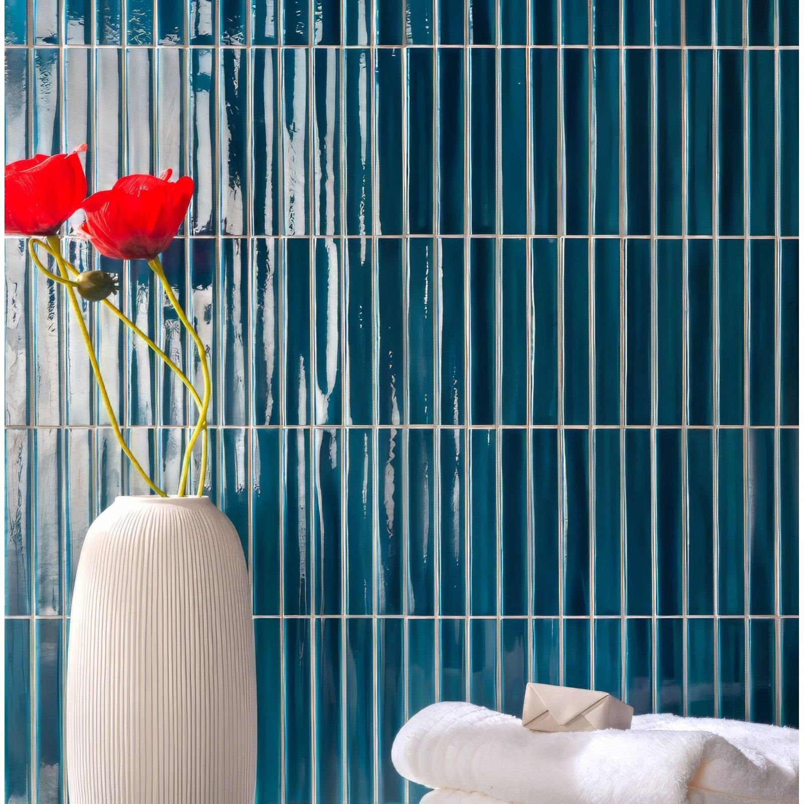 Koeda Sapphire Crackle blue crackle-glaze ceramic mosaic with a white vase of red poppies
