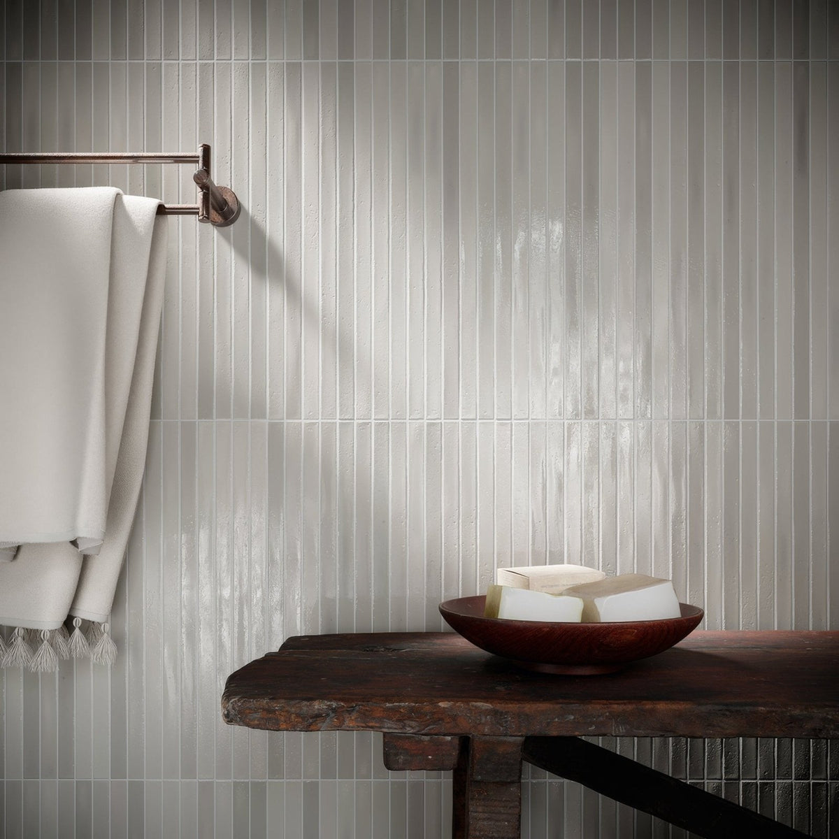 Koeda XL Metropolitan grey ceramic mosaic with a rustic dark wooden table