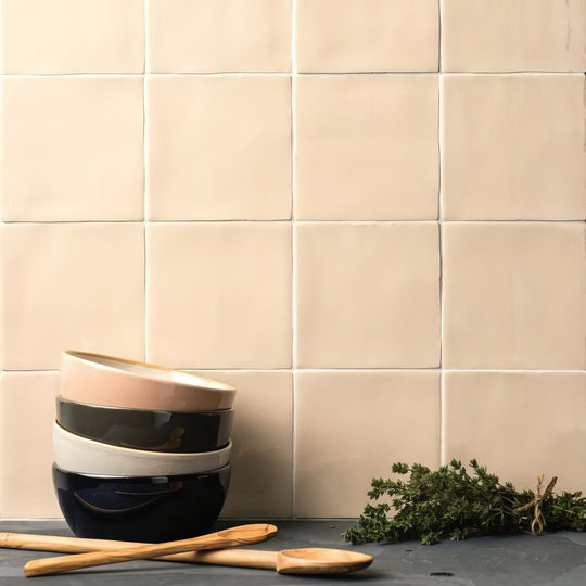 Stack of field tile lace ceramic bowls in soft beige black and white tones with a matte finish