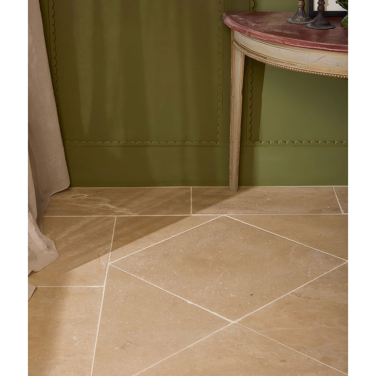 Beige lacock limestone tumbled finish stone tiles with subtle veining arranged in a diamond pattern