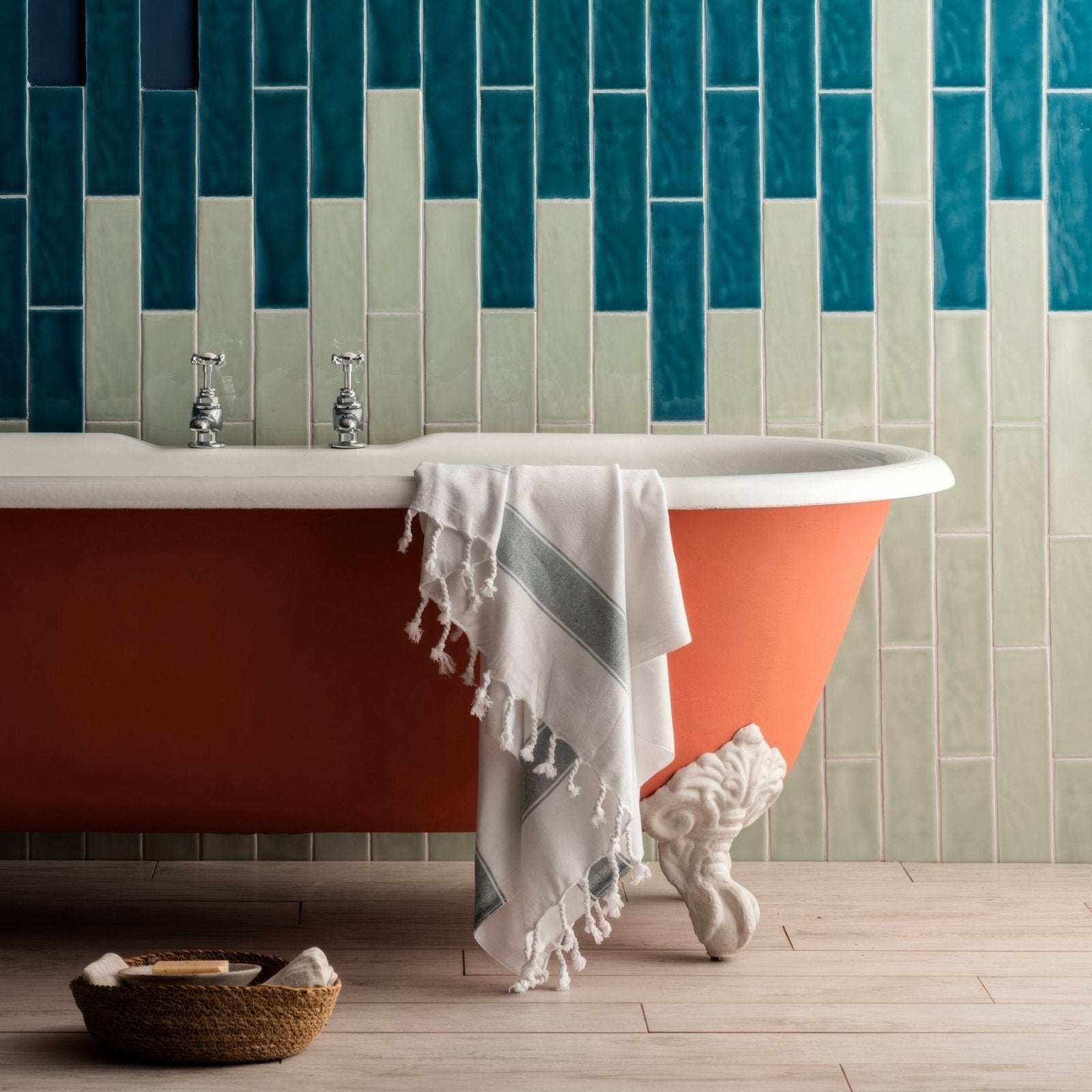 Lagoon large brick tile featuring a vintage-style freestanding bathtub with coral exterior white porcelain rim and ornate feet