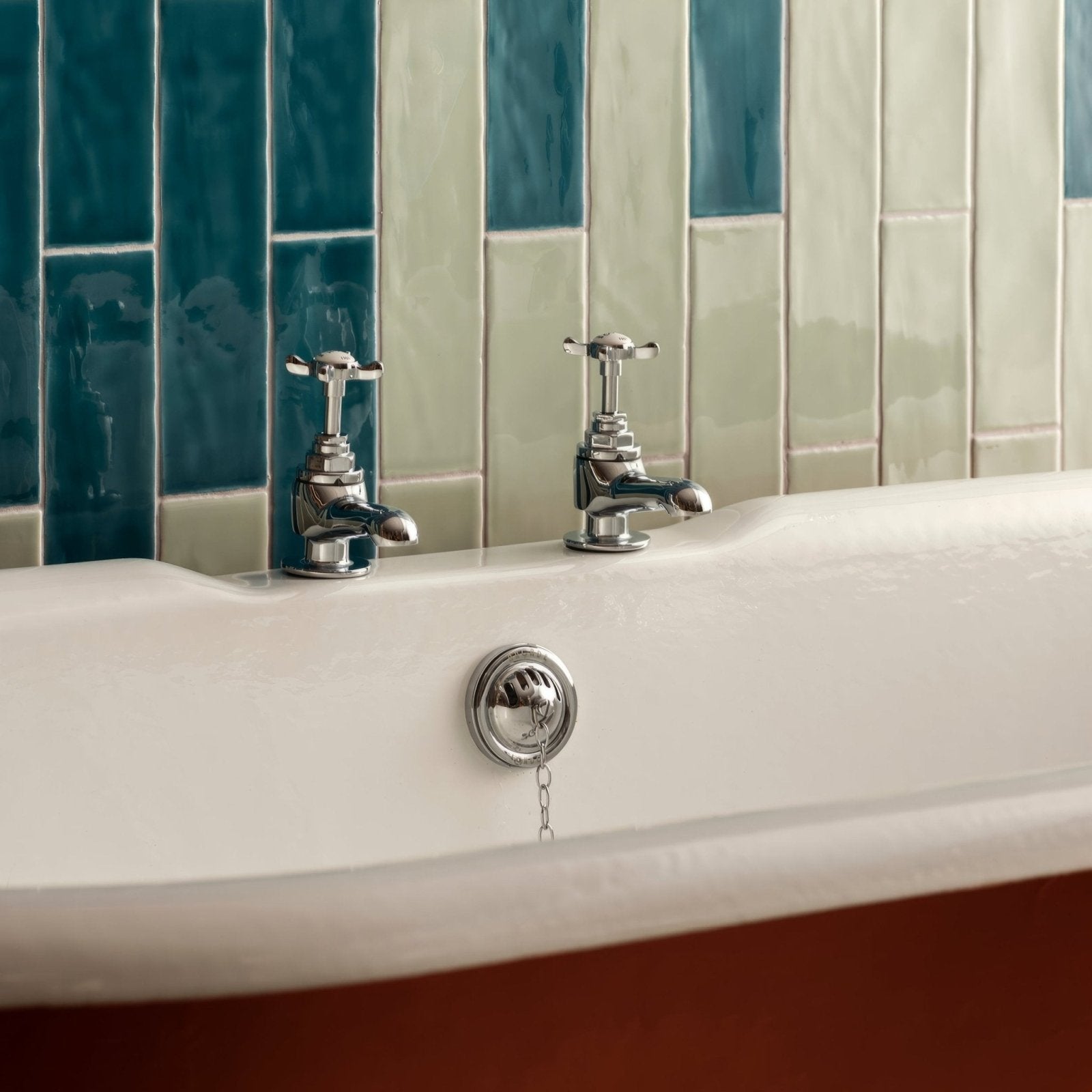 Chrome-finished vintage-style bathtub faucet set with cross handles and chain-operated overflow for lagoon large brick tile