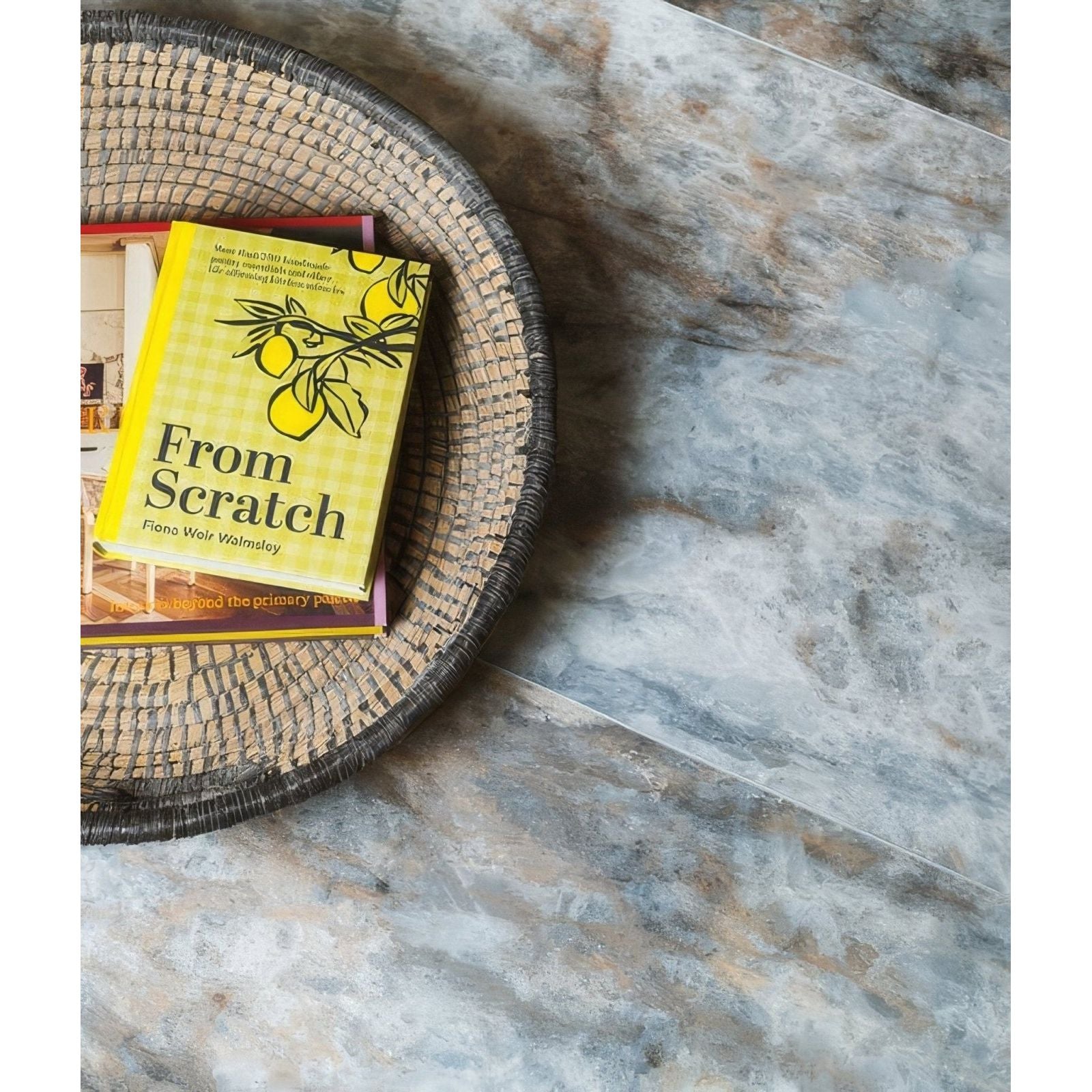 Lake Garda Minerale Pure Gloss Click Tile grey and beige marble-effect tiles with a yellow cookbook
