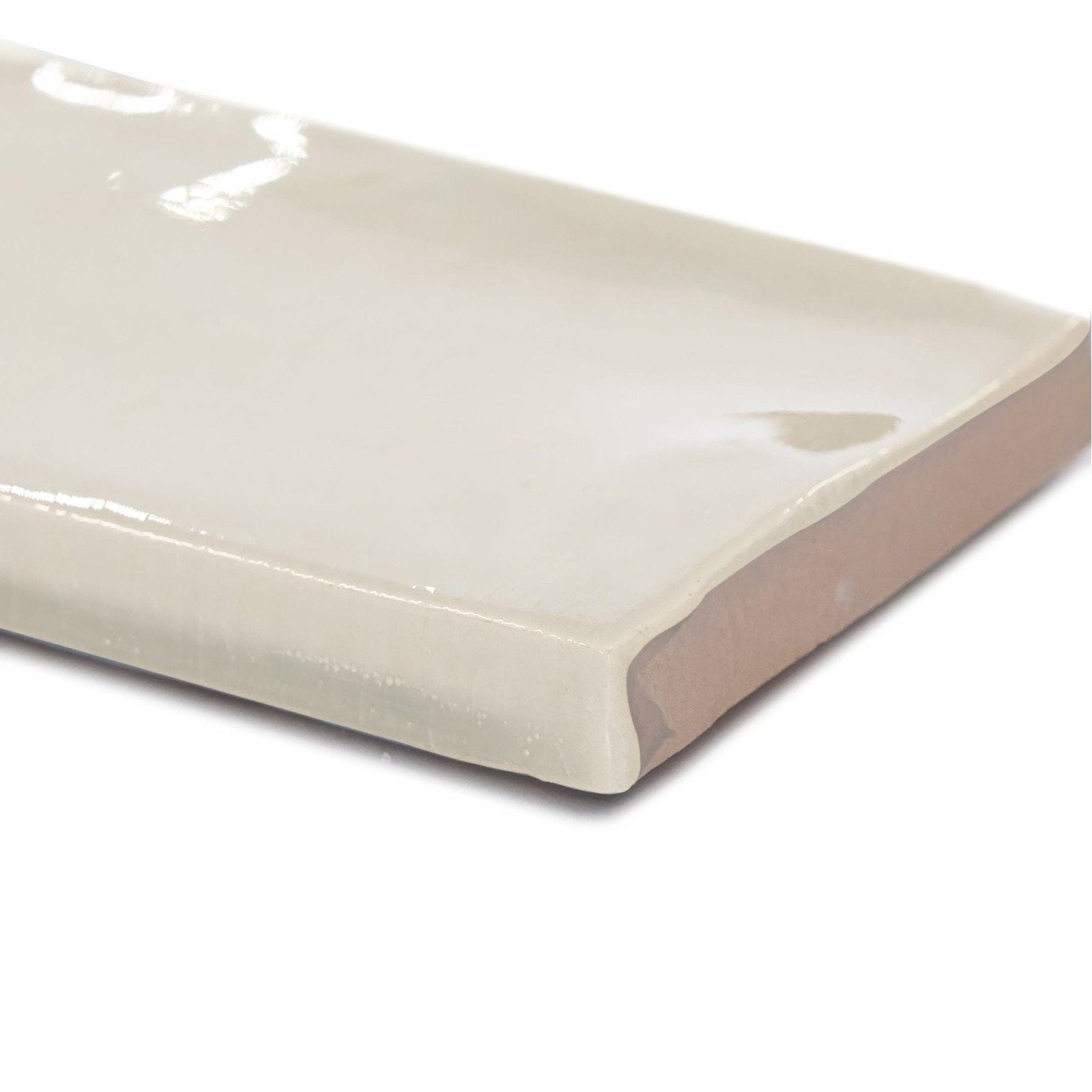 Cream-colored glossy ceramic landscape dawn beige tile with smooth reflective surface and slightly rounded edges