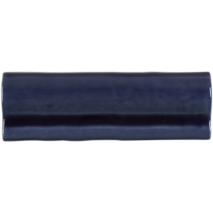 A sleek navy blue ceramic lapis torus moulding tile with a smooth glossy finish and slightly rounded edges