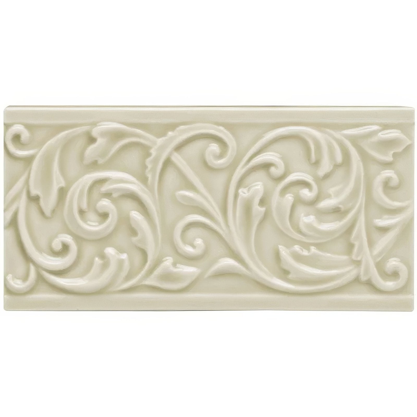 Cream-colored ceramic lavenham buckingham tile with raised ornate floral and scrollwork design