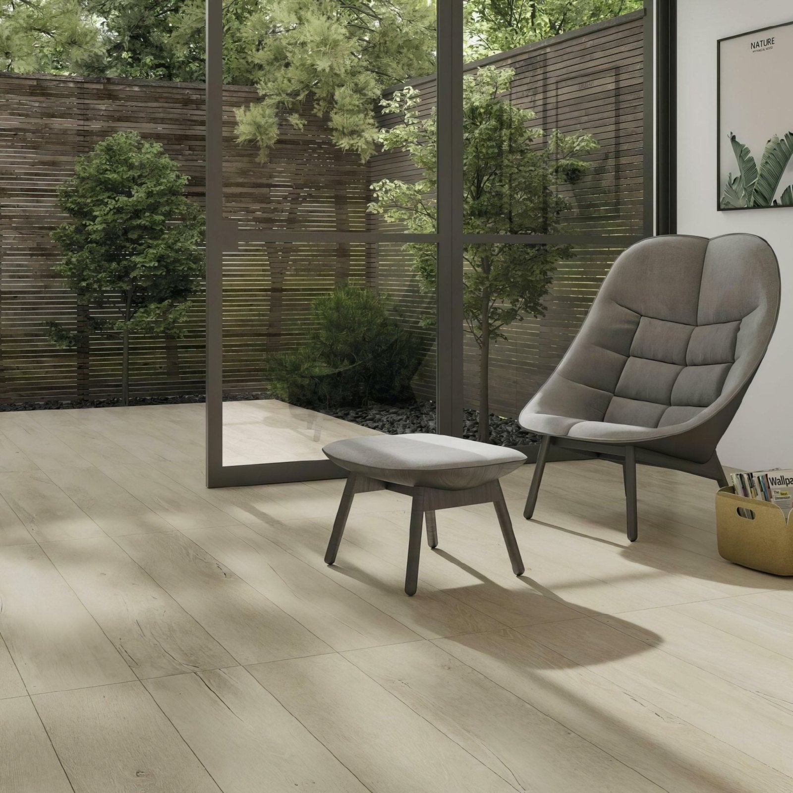 Modern gray upholstered lounge chair with quilted back and sleek wooden legs on lenke maple wood effect tiles
