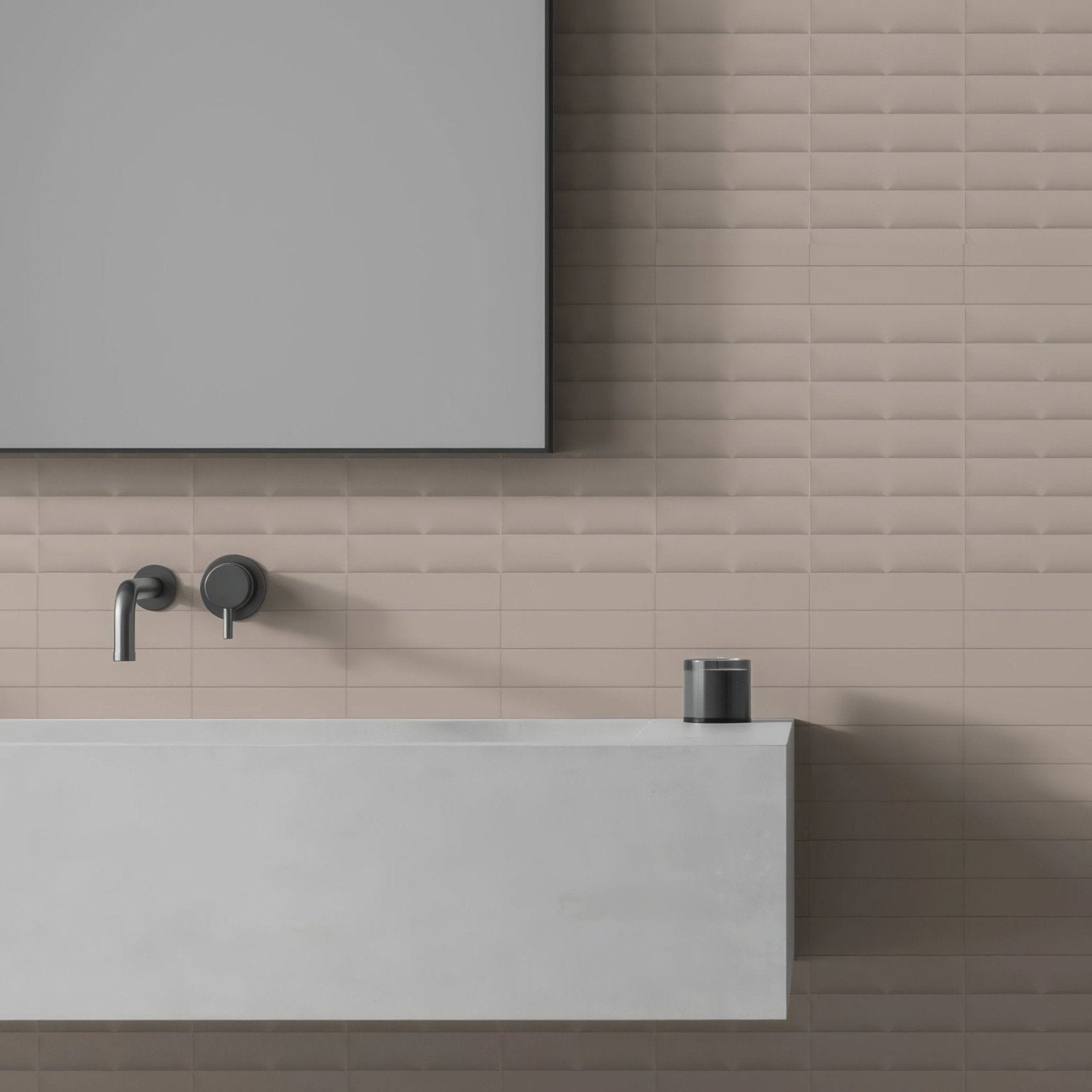 Levante Fold Barley matte gray cylindrical soap dispenser made of sleek material on edge of modern white sink