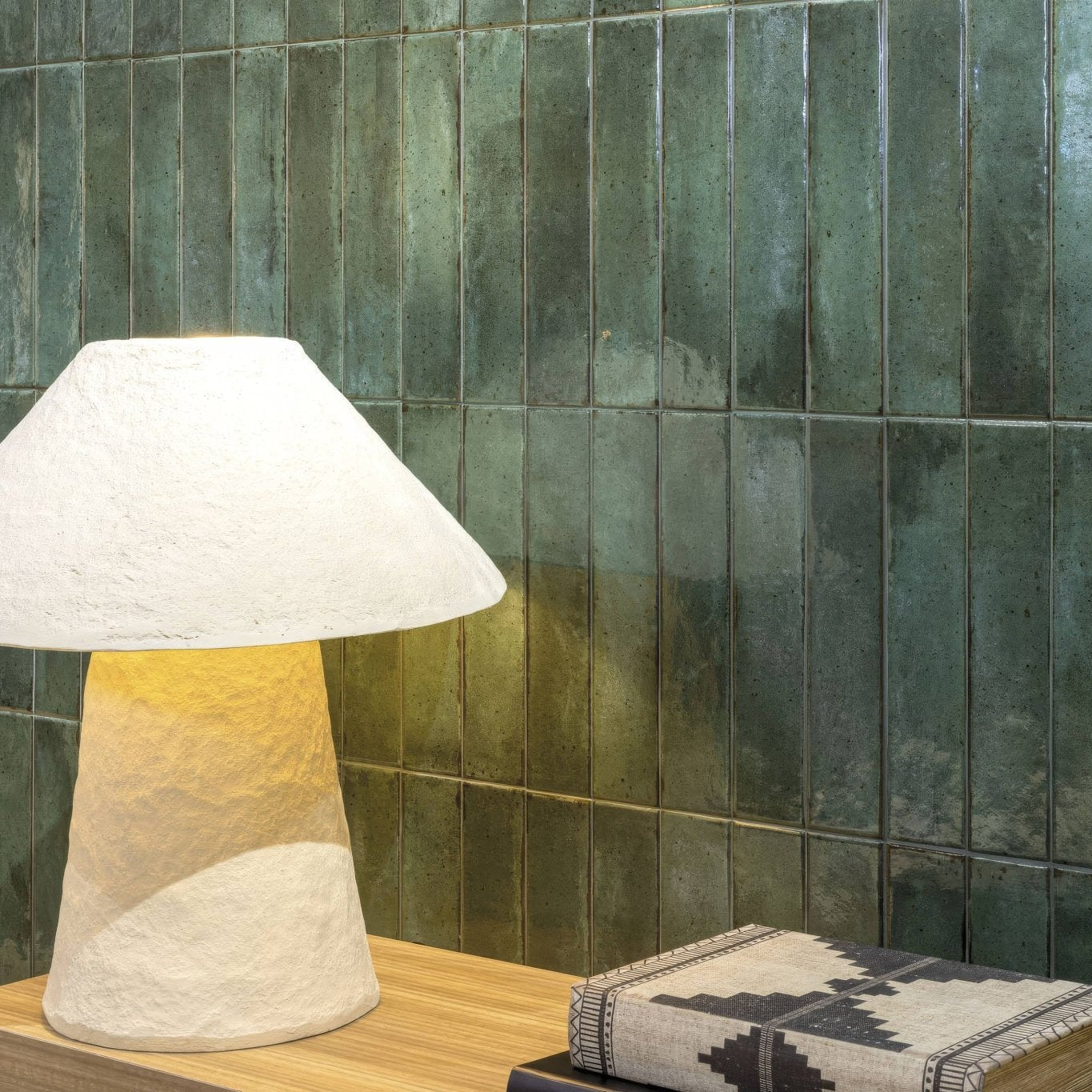 A textured off-white ceramic table lamp with a conical base and wide tapered shade from Lisbon Green Jade Shine