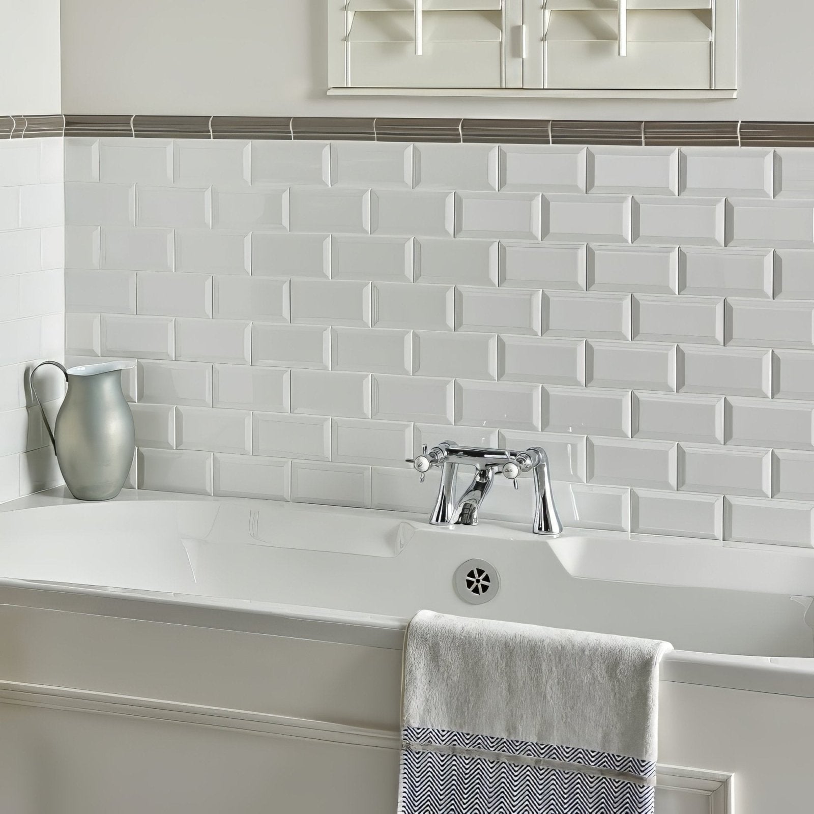 White subway tile backsplash with subtle raised texture and uniform rectangular pattern from london stone albert moulding