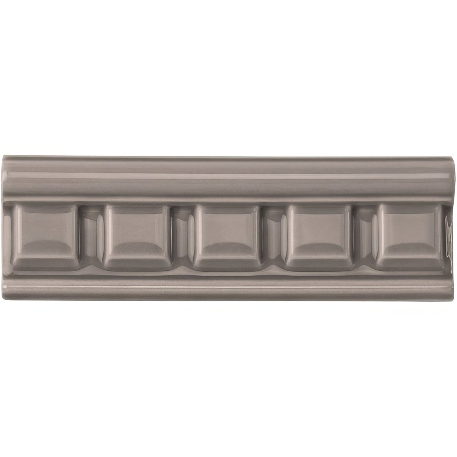 Gray ceramic tile london stone dentil moulding with raised rectangular pattern along the center