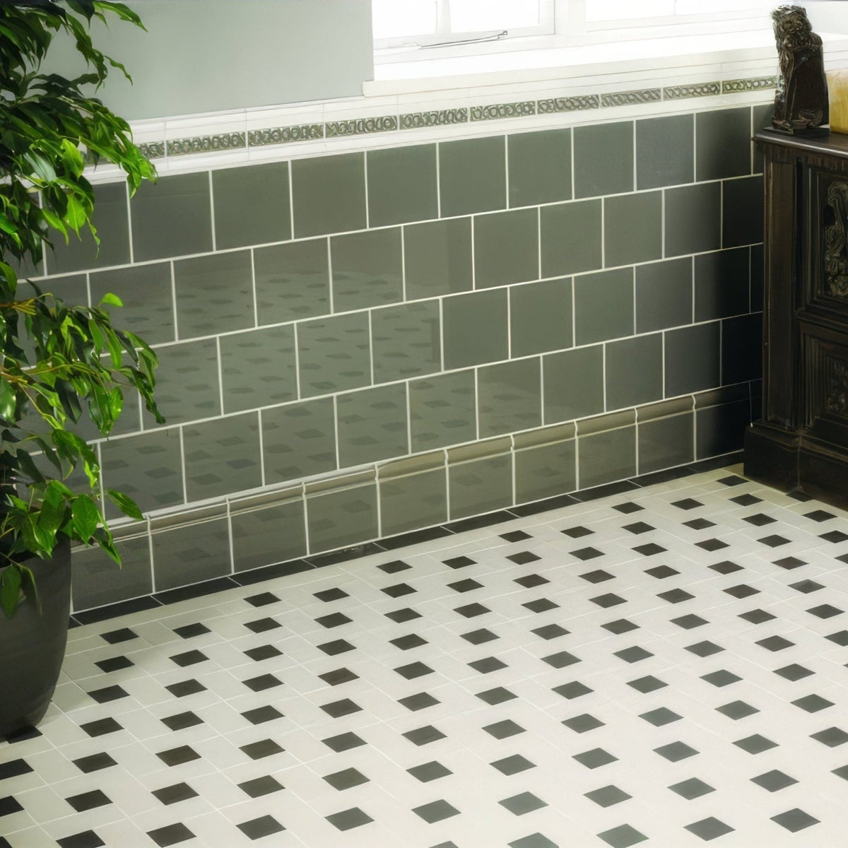 Gray rectangular london stone skirting wall tiles with white grout and decorative border above for interior use