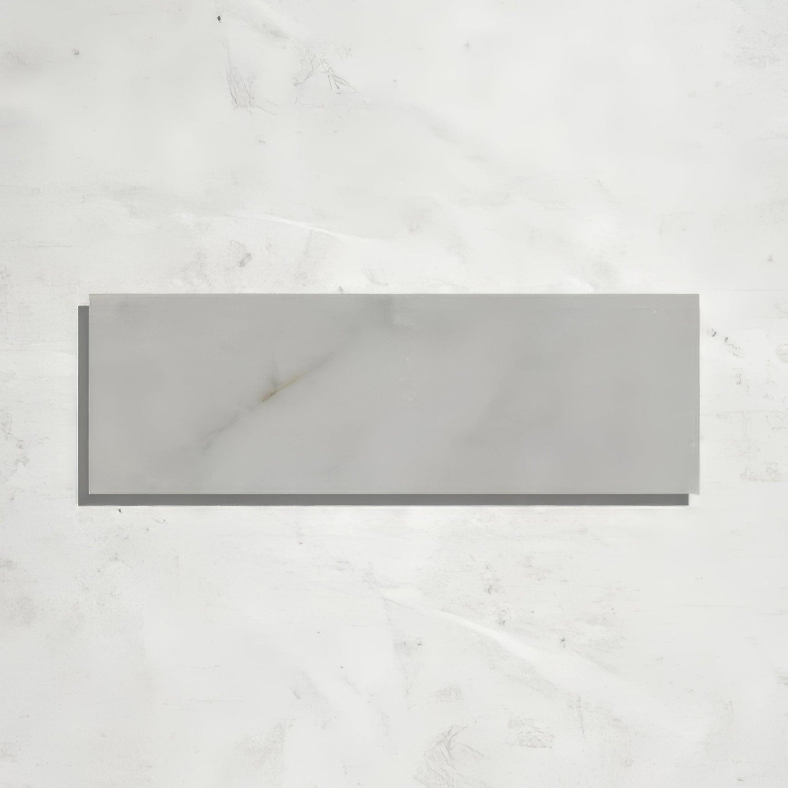Gray rectangular long island marble brick tile with honed finish and subtle white veining resembling marble