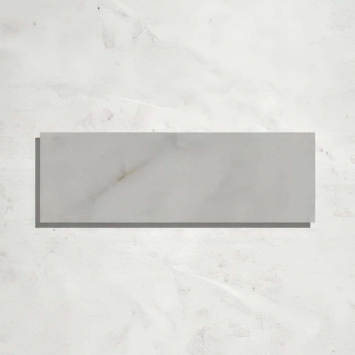 Gray rectangular long island marble brick tile with honed finish and subtle white veining resembling marble