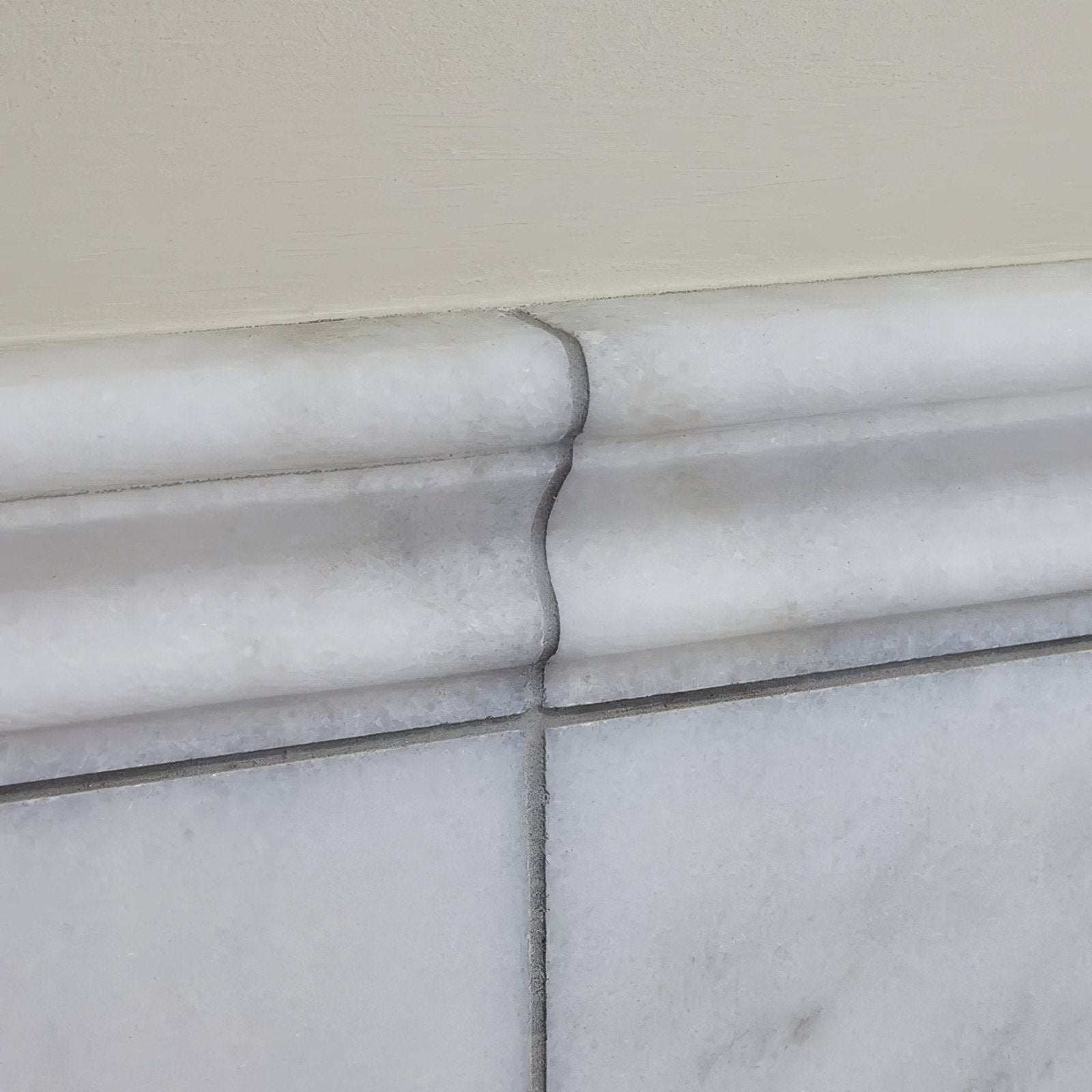 Long island marble dado honed finish white marble baseboard with subtle veining and classic multi tiered profile