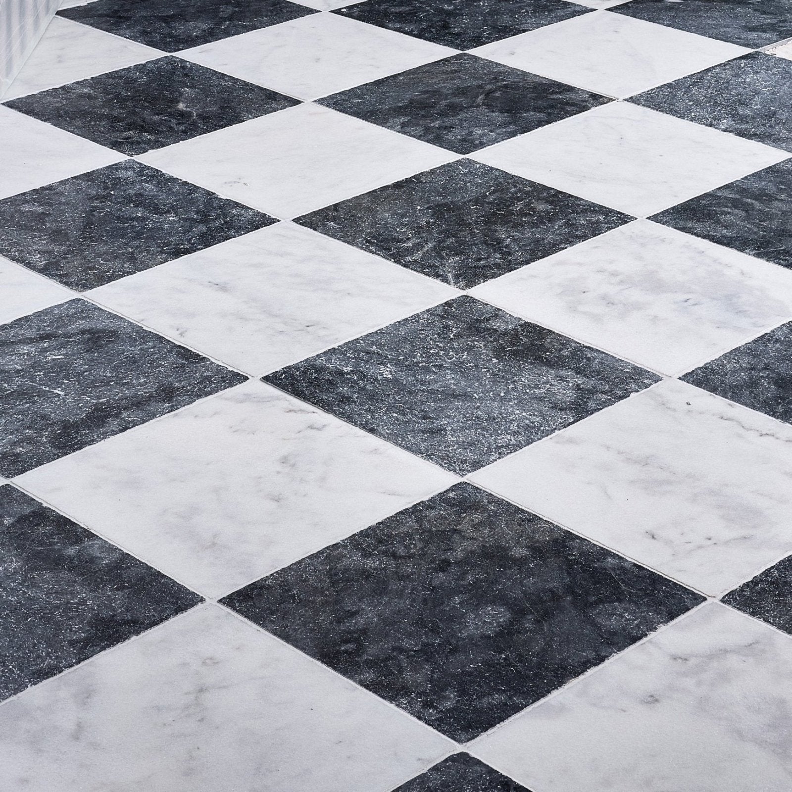 Long island marble tumbled finish 40.6 x 40.6cm black and white marble tiles arranged in diamond pattern