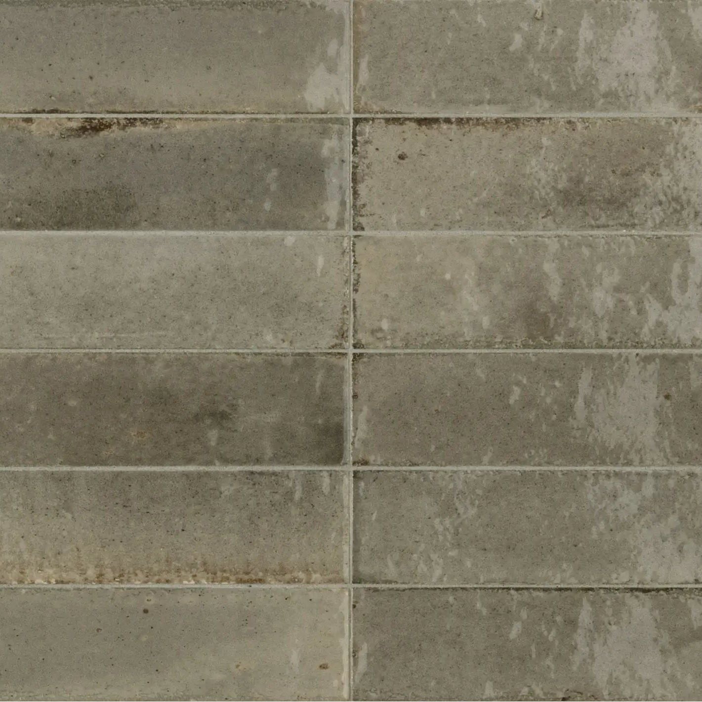 Gray rectangular luminous lume greige tiles with textured weathered finish ideal for modern flooring or walls