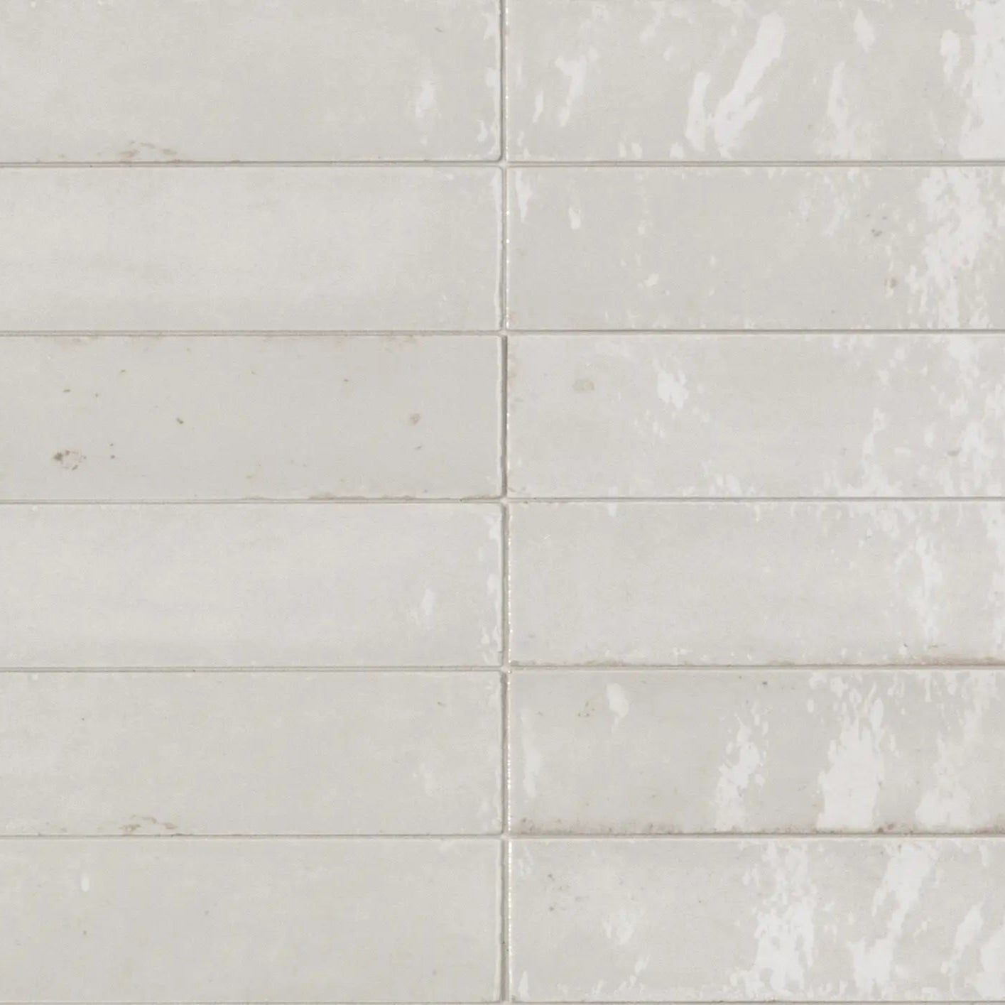 White rectangular subway tiles luminous lume white with a subtle distressed finish and faint veining