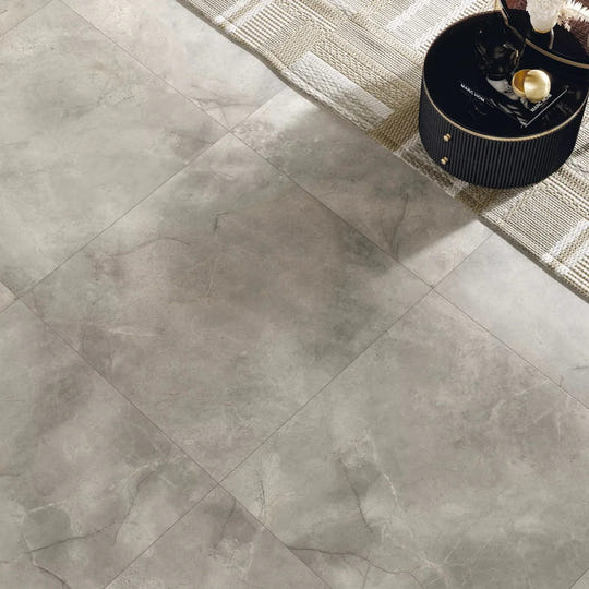 Gray marble-effect Lux White 60 x 60cm floor tiles with subtle veining and a glossy finish