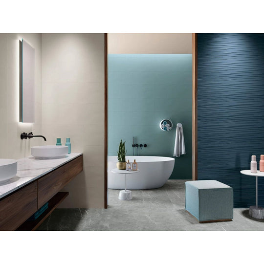 Lyon 1836 Marengo Matt grey marble-effect tiles with a freestanding bathtub