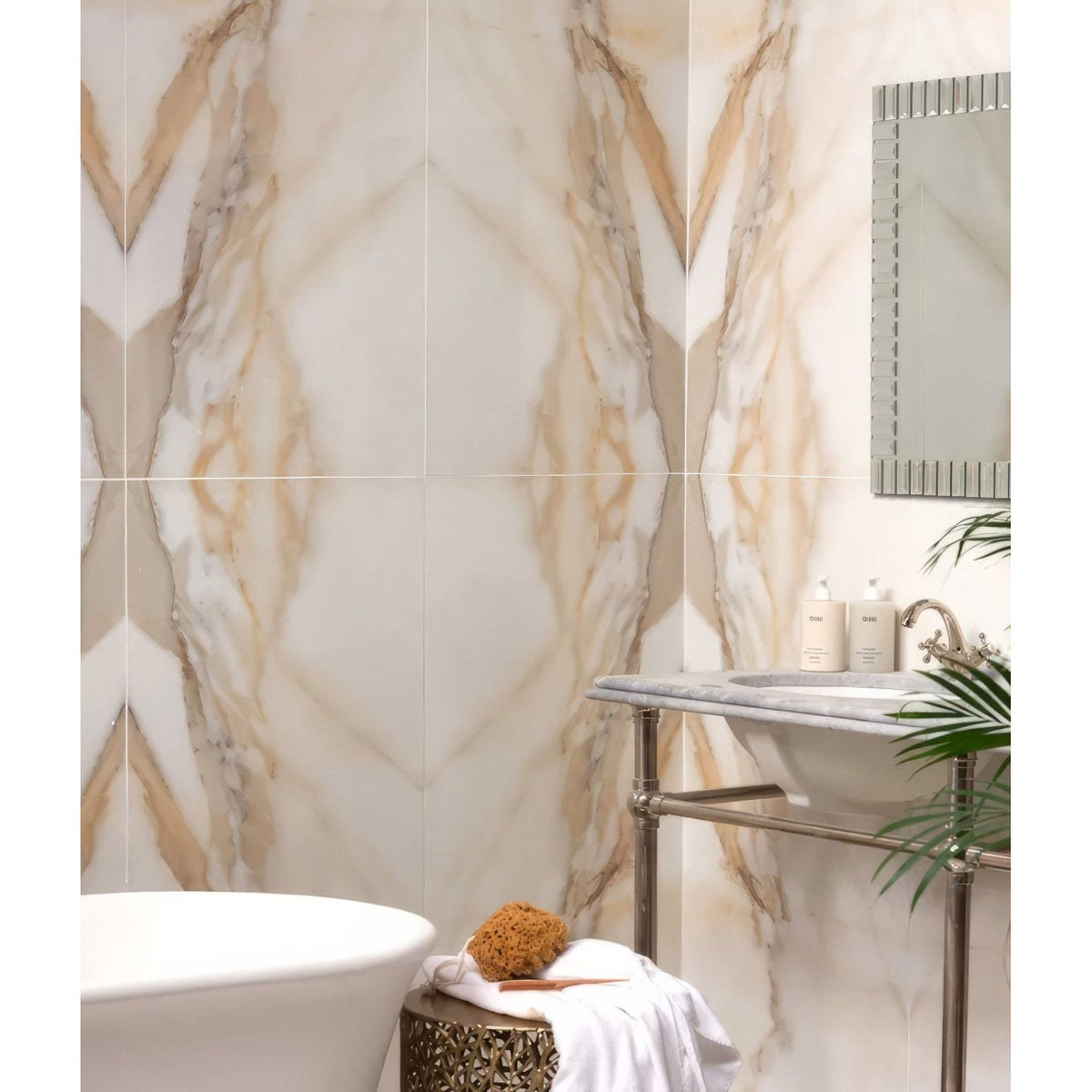 Beige and cream marble-effect porcelain wall tiles with flowing golden veining magnifique oro bookmatched design