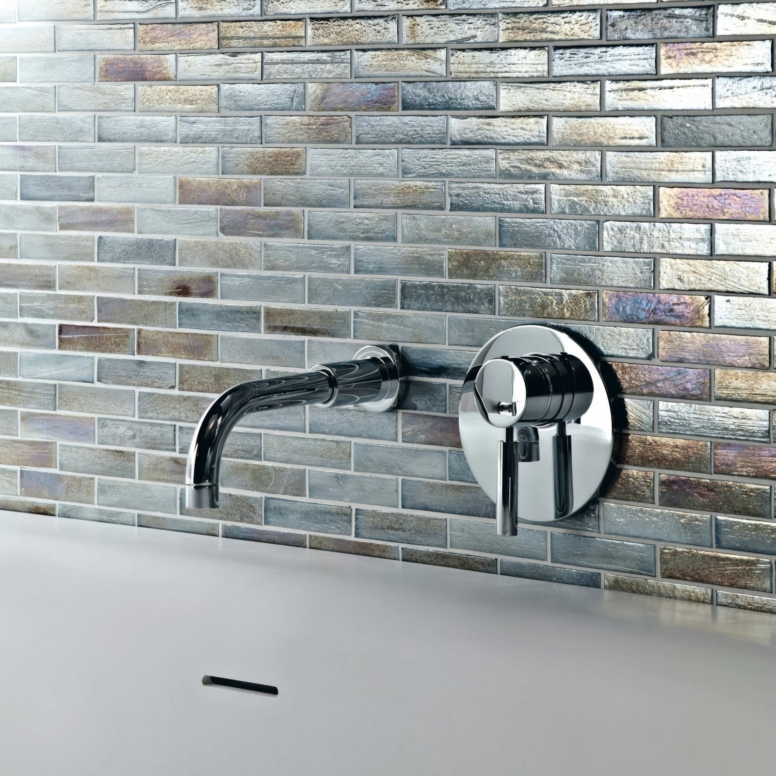 Malacassa Spa Brick Glass Mosaic grey brick glass mosaic with a chrome wall-mounted tap